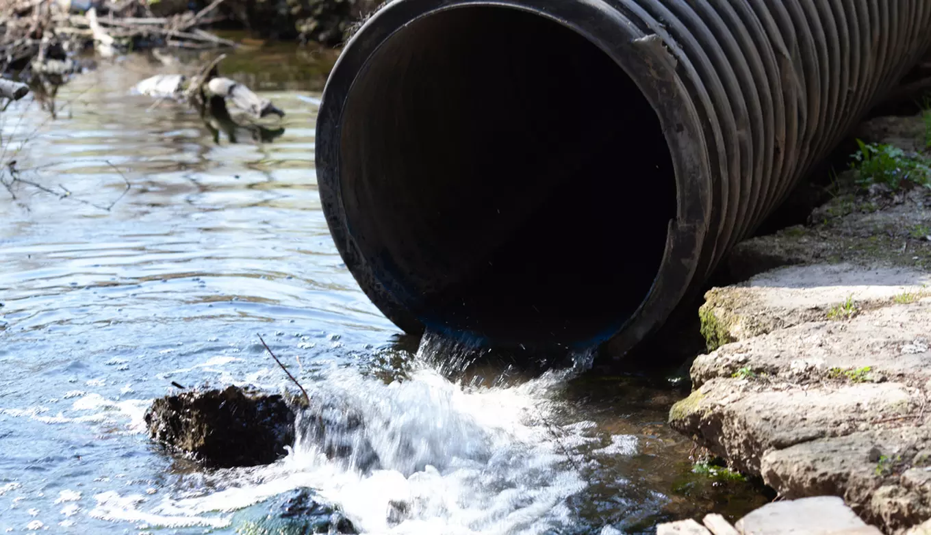 Outfall waste pipe spilling into runoff area