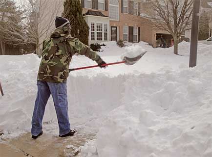 Gentleman Shoveling Sidewalk with over 3 ft of snow