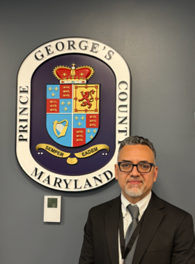 Jose Villegas - image showing Prince George's County seal and a man with glasses looking at the camera