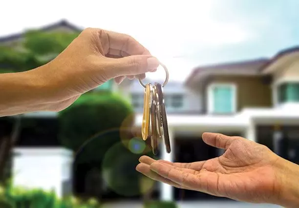 Image of someone being given house keys