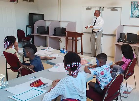 Teacher Joe Fisher in classroom teaching children