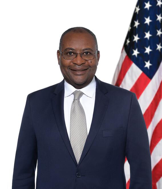 Graphic of DoE Director Samuel Moki