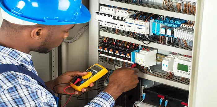 Electrical Inspection at Panel, inspector testing with meter