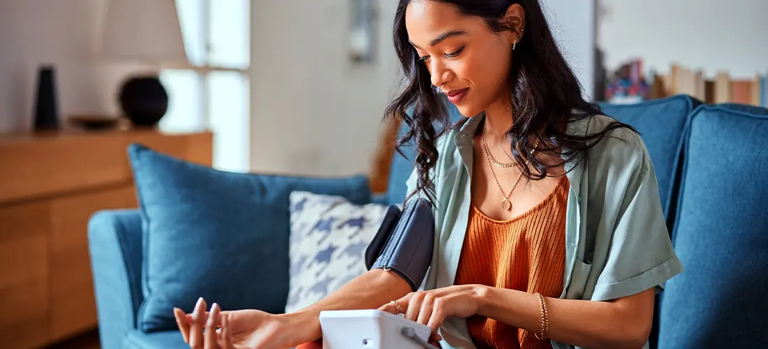 Group of people talking and lauging outdoors.