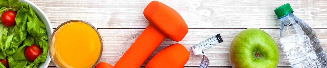 A photo of a salad, weights, a scale, an apple, and water depicting public health.