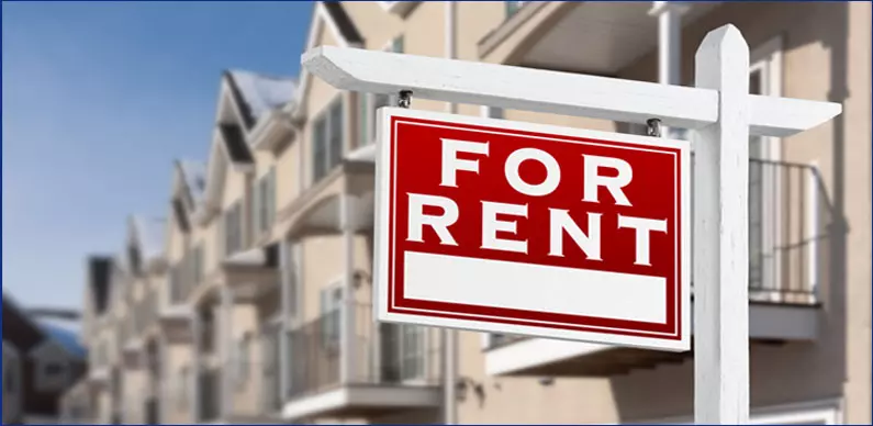 Rent Stabilization Law, row of multifamily housing with a "For Rent" sign in front of the building