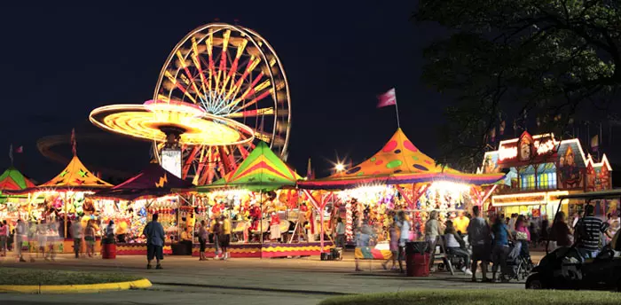 Special Events Permit, photo of fair with ferris wheel, rides, and games