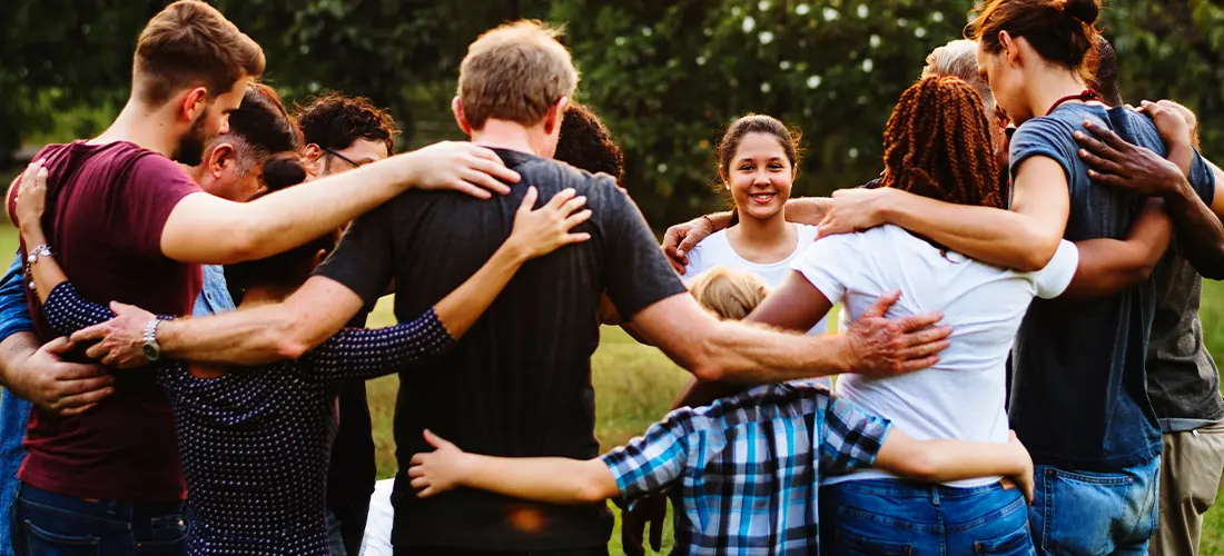 Group of Teens in a circle hugging