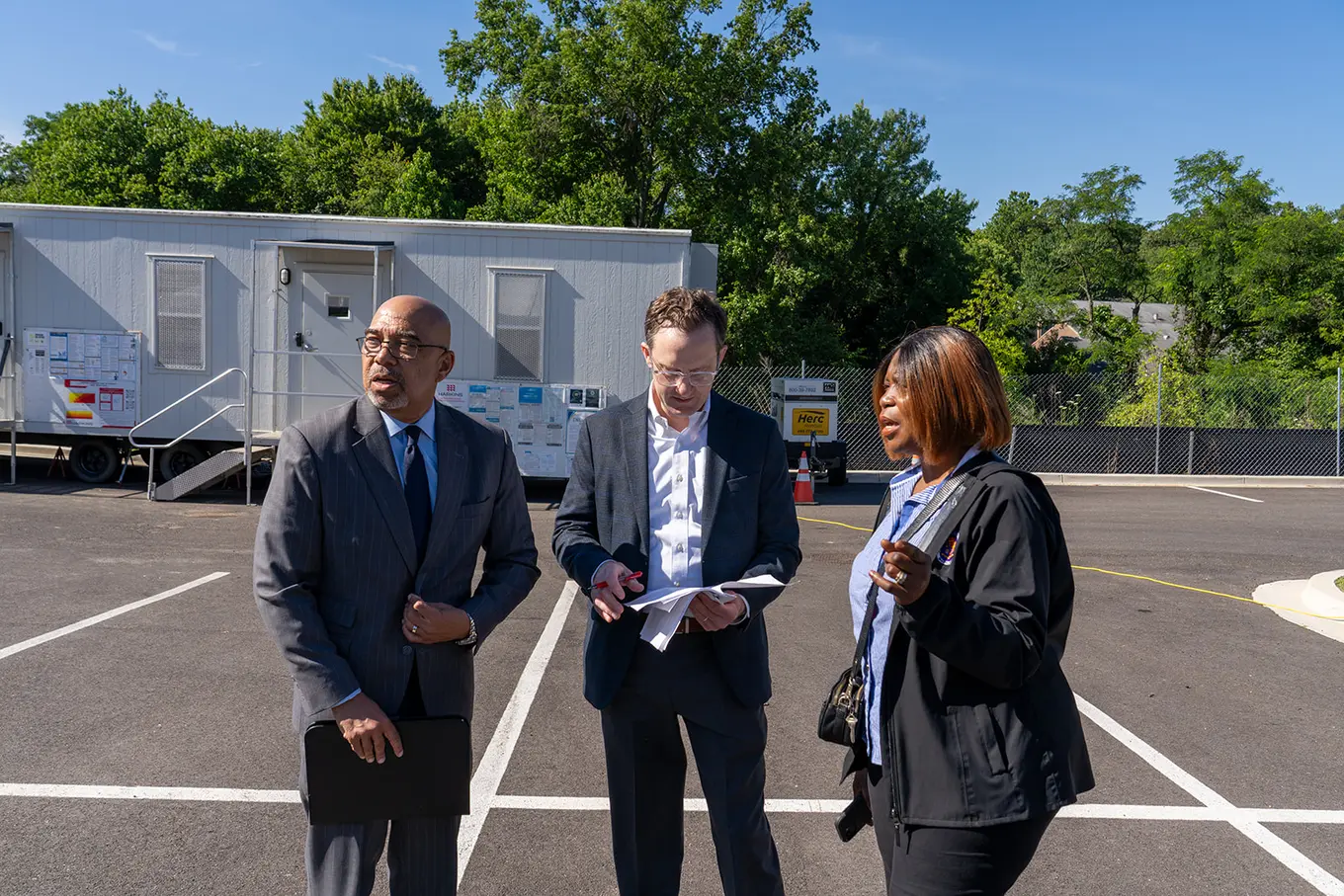 Executive Director Perry Paylor talking with two other individuals