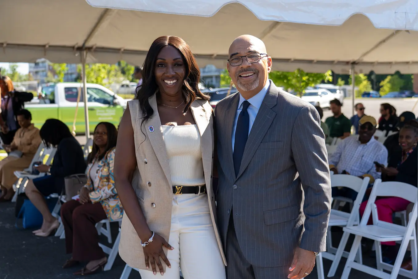 Executive Director Perry Paylor taking a picture with a woman
