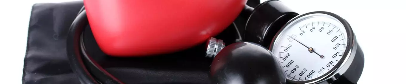 blood pressure gauge and a red heart
