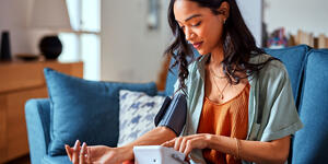 Group of people talking and lauging outdoors.