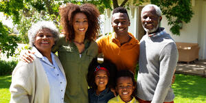 Family standing together outside. 