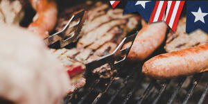 image of food grilling on Independence Day with a flag border