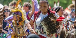 Native American elders and community at a festival