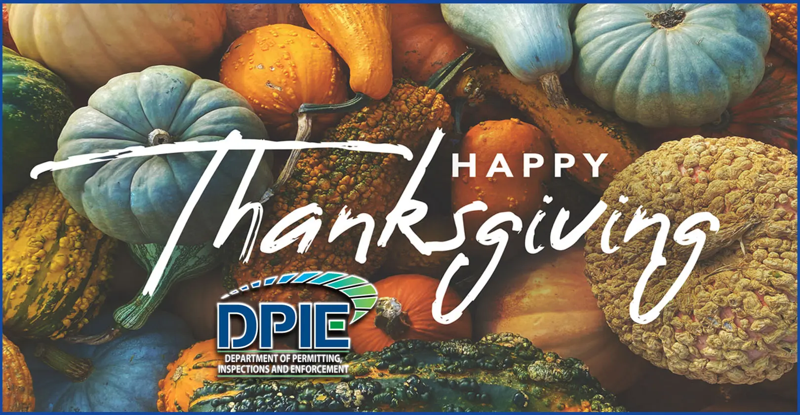 Happy Thanksgiving from DPIE words placed over photo of pumpkins and gourds